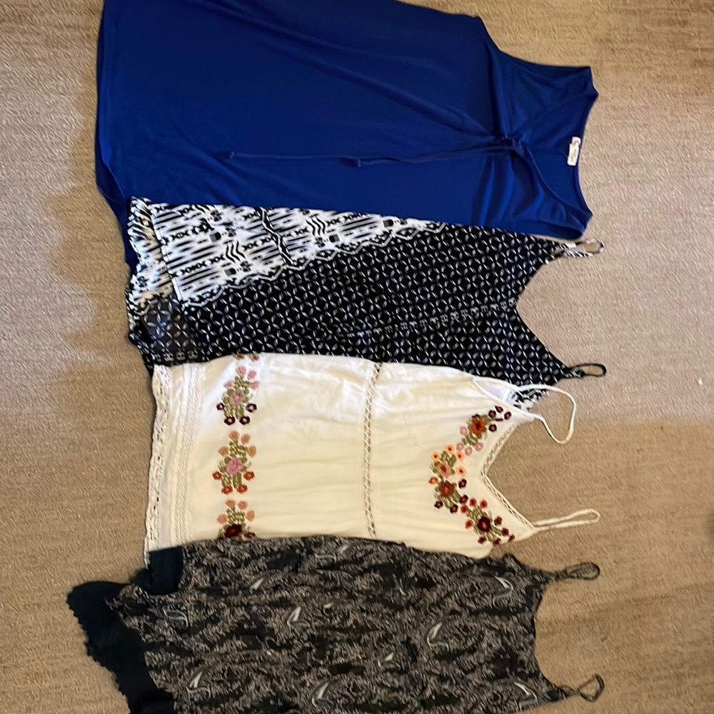 Four beautiful summer dresses size extra small for medium.